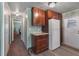 Bright kitchen with wood cabinets, lots of storage, tile countertops, and modern appliances at 1610 Reynolds Rd # 242, Lakeland, FL 33801