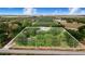Vast aerial view of the property surrounded by agricultural fields and mature trees at 1646 Tyner Rd, Haines City, FL 33844