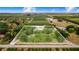 Aerial view displays a large parcel with a home and land in a rural area with a boundary line marked in white at 1646 Tyner Rd, Haines City, FL 33844