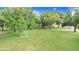 Expansive green backyard featuring mature trees, perfect for recreation and relaxation at 1646 Tyner Rd, Haines City, FL 33844