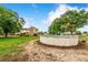 Spacious backyard featuring an above ground pool and lush green space near the home at 1646 Tyner Rd, Haines City, FL 33844