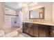 Stylish bathroom featuring a double sink vanity with elegant finishes and a walk-in shower at 1646 Tyner Rd, Haines City, FL 33844