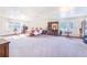 Spacious primary bedroom with large windows and lots of natural light at 1646 Tyner Rd, Haines City, FL 33844