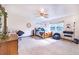 A bright bedroom with soft carpet, ceiling fan, and multiple windows for ample natural light at 1646 Tyner Rd, Haines City, FL 33844