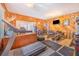 Spacious exercise room featuring wood paneled walls, a treadmill, and a variety of weightlifting equipment at 1646 Tyner Rd, Haines City, FL 33844
