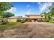 Charming two-story home featuring a spacious front yard and brick pathway leading to the entrance at 1646 Tyner Rd, Haines City, FL 33844