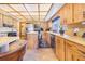 Well-equipped kitchen features wood cabinets, stainless steel appliances, and a functional center island at 1646 Tyner Rd, Haines City, FL 33844