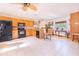 Well-lit kitchen with black appliances and granite countertops, open to the living area at 1646 Tyner Rd, Haines City, FL 33844