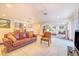 Living room and seating area off primary bedroom with leather couch at 1646 Tyner Rd, Haines City, FL 33844