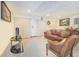 Cozy living room featuring tile floors and a leather couch at 1646 Tyner Rd, Haines City, FL 33844