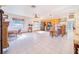 Open-concept living area with natural light, tile floor, and kitchen view at 1646 Tyner Rd, Haines City, FL 33844