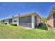 A spacious screened-in patio and back yard, great for outdoor living and entertaining at 1674 Linz Ct, Winter Haven, FL 33884