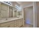 Bathroom vanity with double sinks and an adjacent walk-in shower at 1674 Linz Ct, Winter Haven, FL 33884