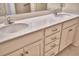 Bathroom double sink vanity with stone countertops and updated hardware at 1674 Linz Ct, Winter Haven, FL 33884