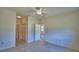 Spacious bedroom with tile flooring, a ceiling fan and a closet at 1674 Linz Ct, Winter Haven, FL 33884