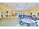 Large clubhouse room features ample seating, wood floors, and abundant light for community gatherings at 1674 Linz Ct, Winter Haven, FL 33884