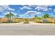 Elegant community entrance gate with manicured landscaping and signage under a bright blue sky at 1674 Linz Ct, Winter Haven, FL 33884