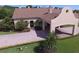 Beautiful clubhouse and manicured landscaping create an inviting space at 1674 Linz Ct, Winter Haven, FL 33884