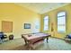 Bright game room featuring a pool table, dart board, and ample space for recreational activities at 1674 Linz Ct, Winter Haven, FL 33884
