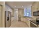 Spacious kitchen with stainless steel appliances, granite countertops, and ample storage at 1674 Linz Ct, Winter Haven, FL 33884