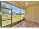 Enclosed screened lanai featuring tile flooring, neutral walls and backyard views at 1674 Linz Ct, Winter Haven, FL 33884