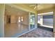View from the screened in back patio looking into the home's open living area at 1674 Linz Ct, Winter Haven, FL 33884