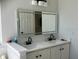 Modern bathroom with double sinks, sleek countertops, and stylish fixtures at 1681 Waterview Loop, Haines City, FL 33844