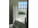 Relaxing bathroom with a soaking tub and a separate glass-enclosed shower at 1681 Waterview Loop, Haines City, FL 33844