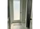 Bathroom featuring a door leading to the outside and a shower curtain at 1681 Waterview Loop, Haines City, FL 33844