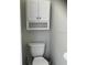Compact half-bathroom with a toilet at 1681 Waterview Loop, Haines City, FL 33844