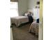 Cozy bedroom featuring twin beds with patterned bedding and a large window for natural light at 1681 Waterview Loop, Haines City, FL 33844