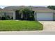 Charming single-story home with a well-manicured lawn and mature trees at 1681 Waterview Loop, Haines City, FL 33844