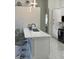 Bright kitchen with a breakfast bar, stainless steel appliances, and modern pendant lighting at 1681 Waterview Loop, Haines City, FL 33844