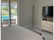 Bright main bedroom with a view of the pool and a dresser at 1681 Waterview Loop, Haines City, FL 33844