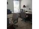 Bright office featuring a large window, dual desks, and plenty of storage space at 1681 Waterview Loop, Haines City, FL 33844