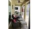 Outdoor patio seating area features two chairs and two ottomans at 1681 Waterview Loop, Haines City, FL 33844