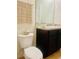 Bathroom featuring a vanity, toilet, and mirror at 1760 Carnostie Rd, Winter Haven, FL 33884