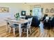 Dining area with table and chairs, hardwood floors, and open layout to the living room at 1760 Carnostie Rd, Winter Haven, FL 33884