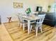 Dining area features hardwood flooring, neutral walls, and seamlessly connects with the living area at 1760 Carnostie Rd, Winter Haven, FL 33884