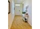 Welcoming entryway with neutral tile flooring, console table, and natural light at 1760 Carnostie Rd, Winter Haven, FL 33884