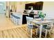 Kitchen with stainless steel appliances, dark wood cabinets, and bar stool seating at the island at 1760 Carnostie Rd, Winter Haven, FL 33884