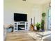 Living room featuring modern furniture, TV, and wood floors at 1760 Carnostie Rd, Winter Haven, FL 33884