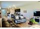 Open concept living space with kitchen, dining area, and comfortable seating with natural lighting at 1760 Carnostie Rd, Winter Haven, FL 33884
