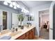 Bright bathroom featuring double vanity with spacious countertop, neutral color palette, and step-in shower at 177 Costa Loop, Auburndale, FL 33823