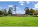 Landscaped entrance to The Estates of Auburndale with stone signage and manicured greenery at 177 Costa Loop, Auburndale, FL 33823