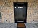 Inviting front entrance featuring a dark-stained door, brick facade, and a welcoming doormat at 1781 Lakehill Dr, Winter Haven, FL 33884