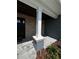 Stylish front porch with brick accents, a prominent support column, and elegant pavers at 1781 Lakehill Dr, Winter Haven, FL 33884