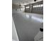 Spacious two-car garage with epoxy floor and automatic doors for convenient parking and storage at 1781 Lakehill Dr, Winter Haven, FL 33884