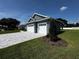 Beautiful home showcasing a two-car garage, paved driveway, and lush green lawn on a sunny day at 1781 Lakehill Dr, Winter Haven, FL 33884