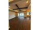 Spacious living room featuring wood floors, a ceiling fan, recessed lights, and access to the outdoors at 1781 Lakehill Dr, Winter Haven, FL 33884